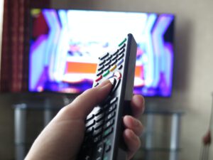 Remote control, watching television tv at home